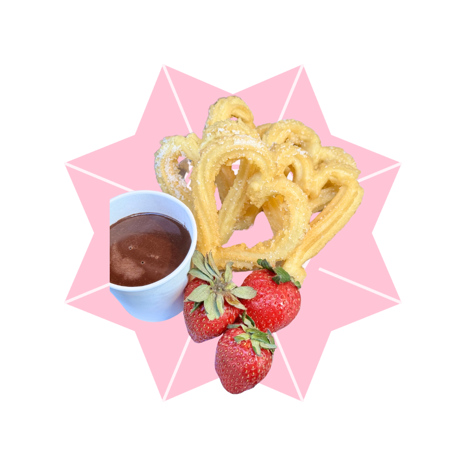  heart churros, a cup of chocolate sauce and some strawberries