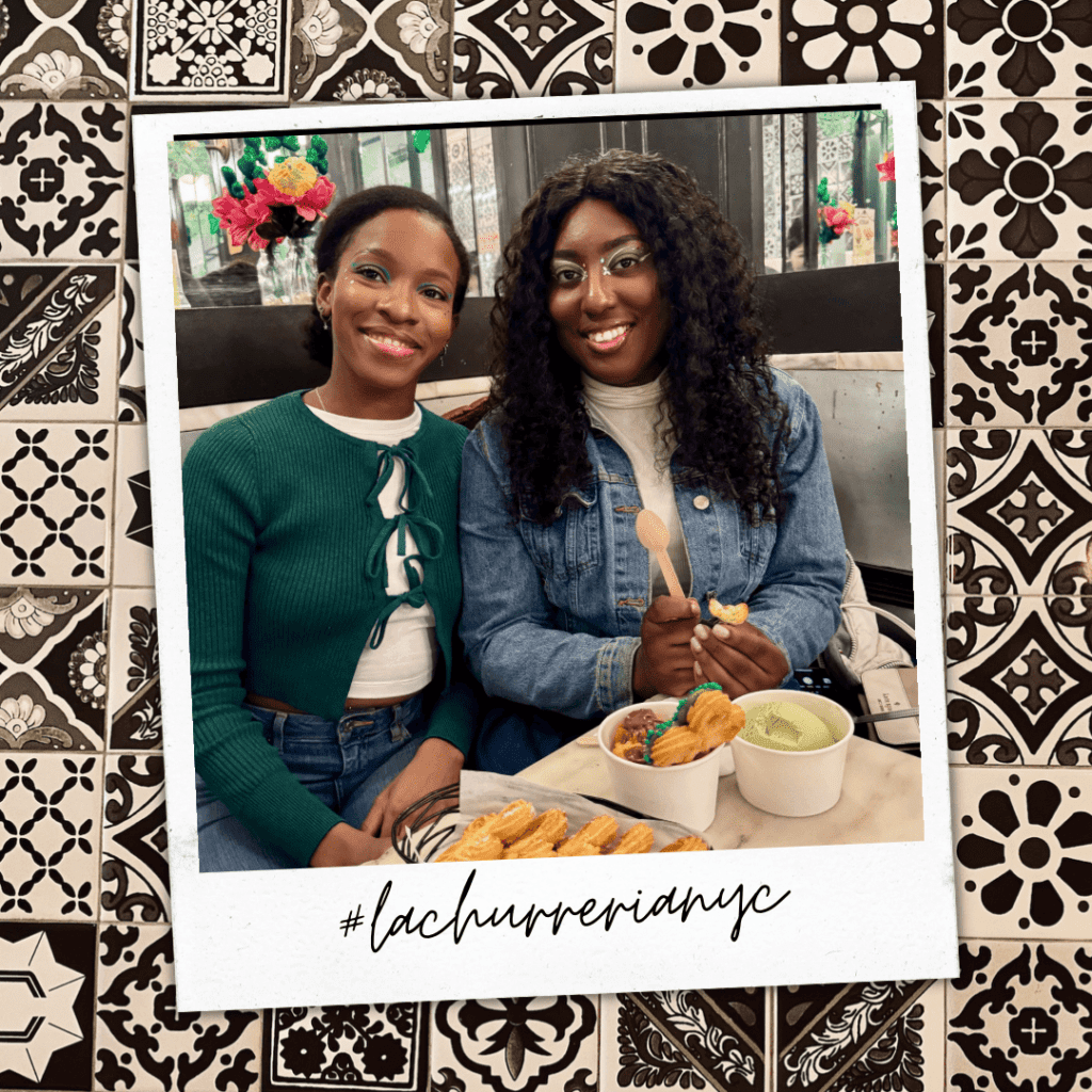 two girls having churros at La Churreria nyc