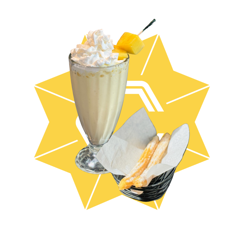 Milksake dessert with two churros mango ice cream, milk, whipped cream, two churros dessert