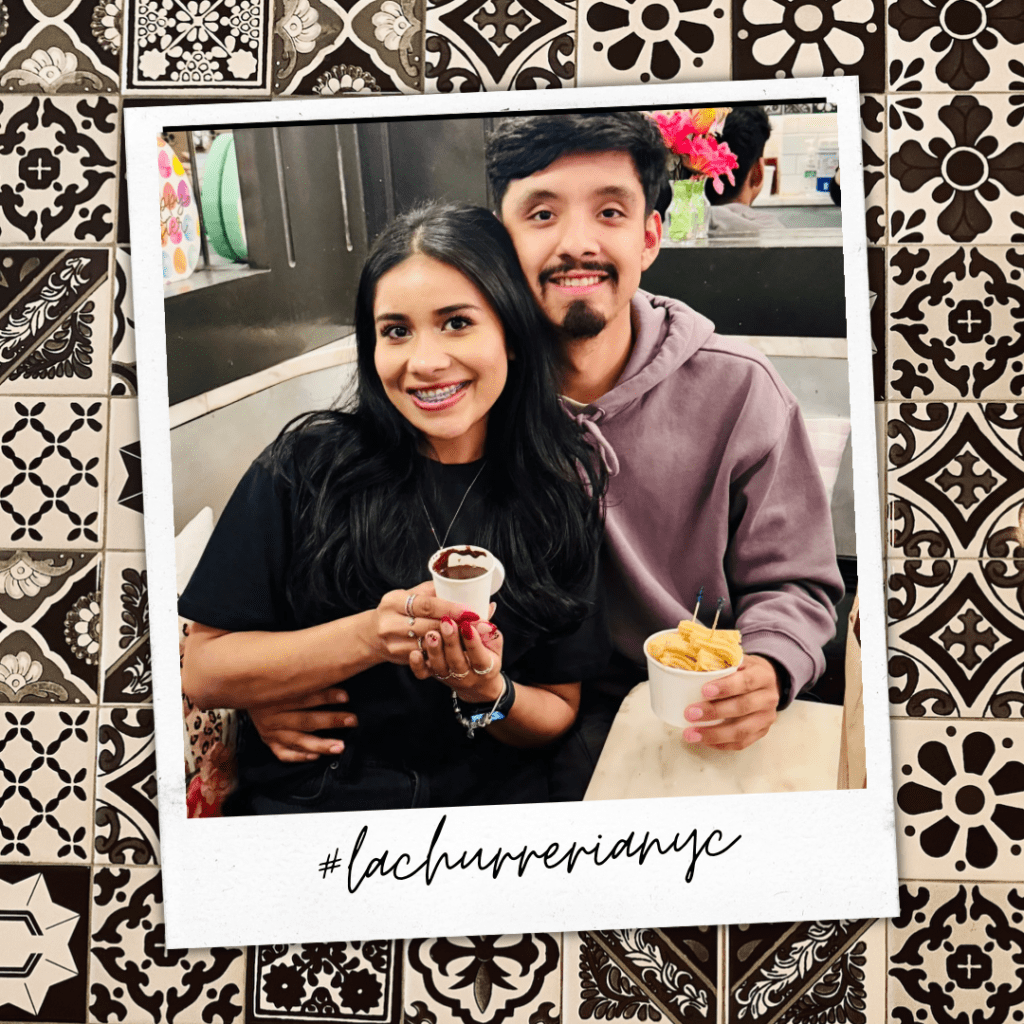 Couple enjoying churros and chocolate together at La Churrería NYC